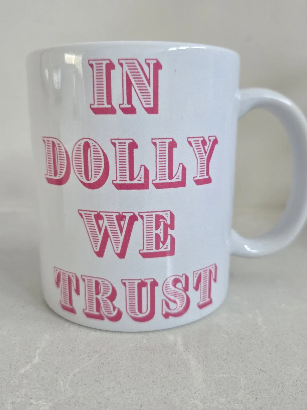 In Dolly We Trust Brand New Ceramic Coffee Mug Dolly Pardon White Pink 3.75